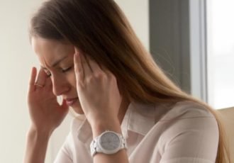 A woman deals with caffeine-induced headache